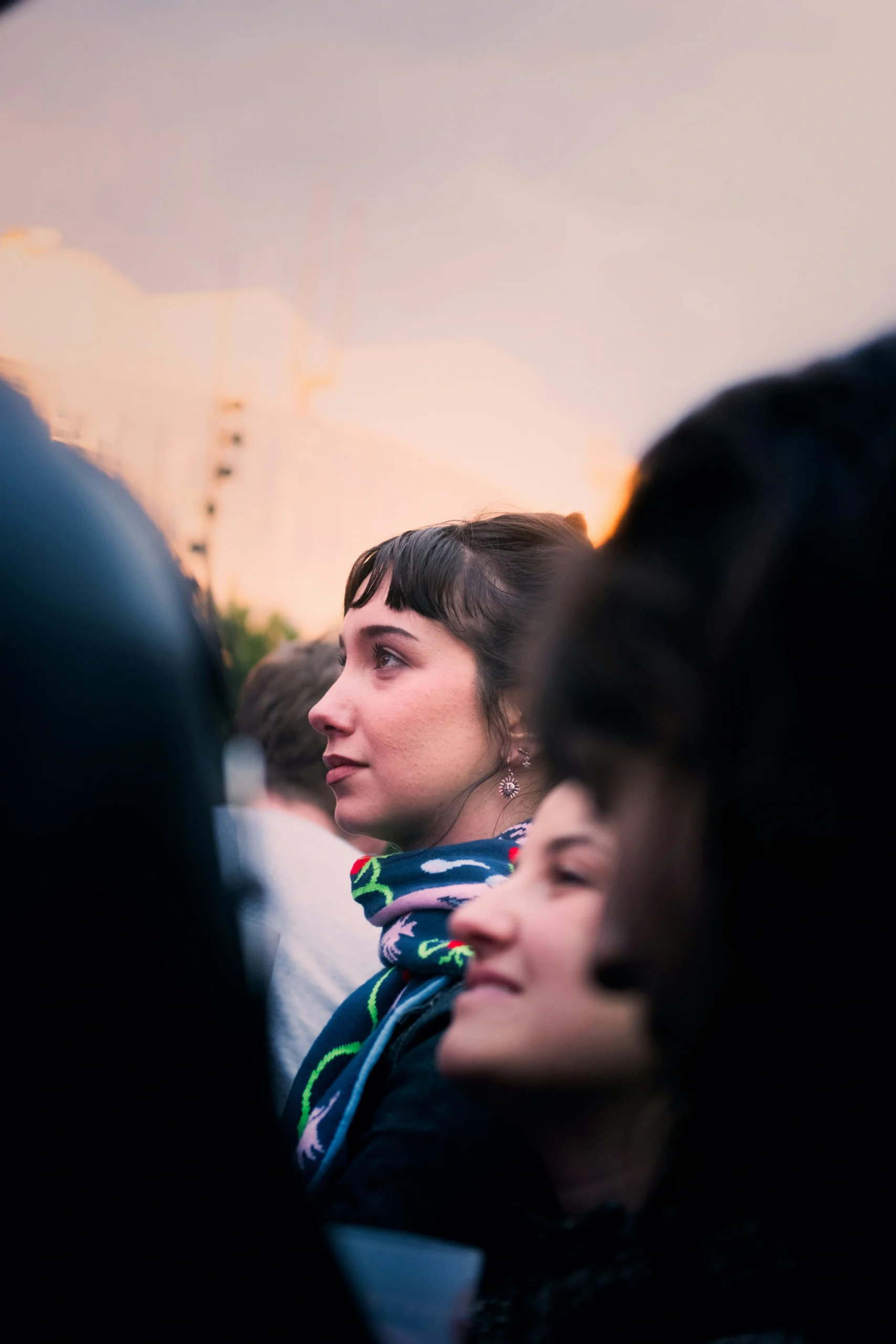 A woman listening at a community gathering.